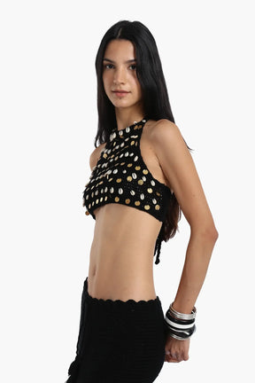 توب مزين بالأصداف والعملات