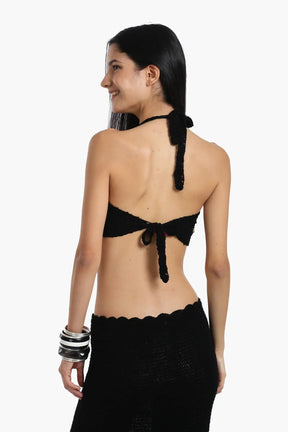 توب مزين بالأصداف والعملات