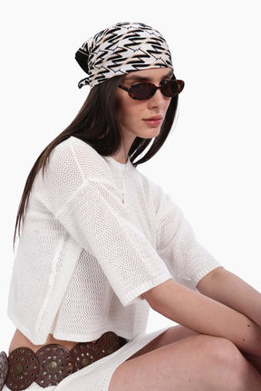 طقم تريكو من بلوزة قصيرة وجيب