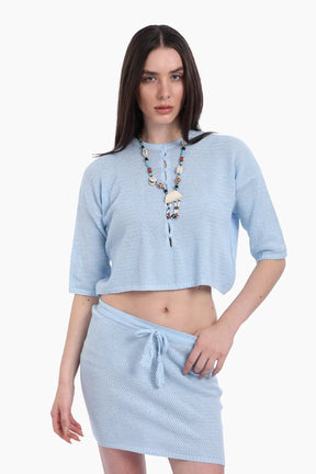 طقم تريكو من بلوزة قصيرة وجيب