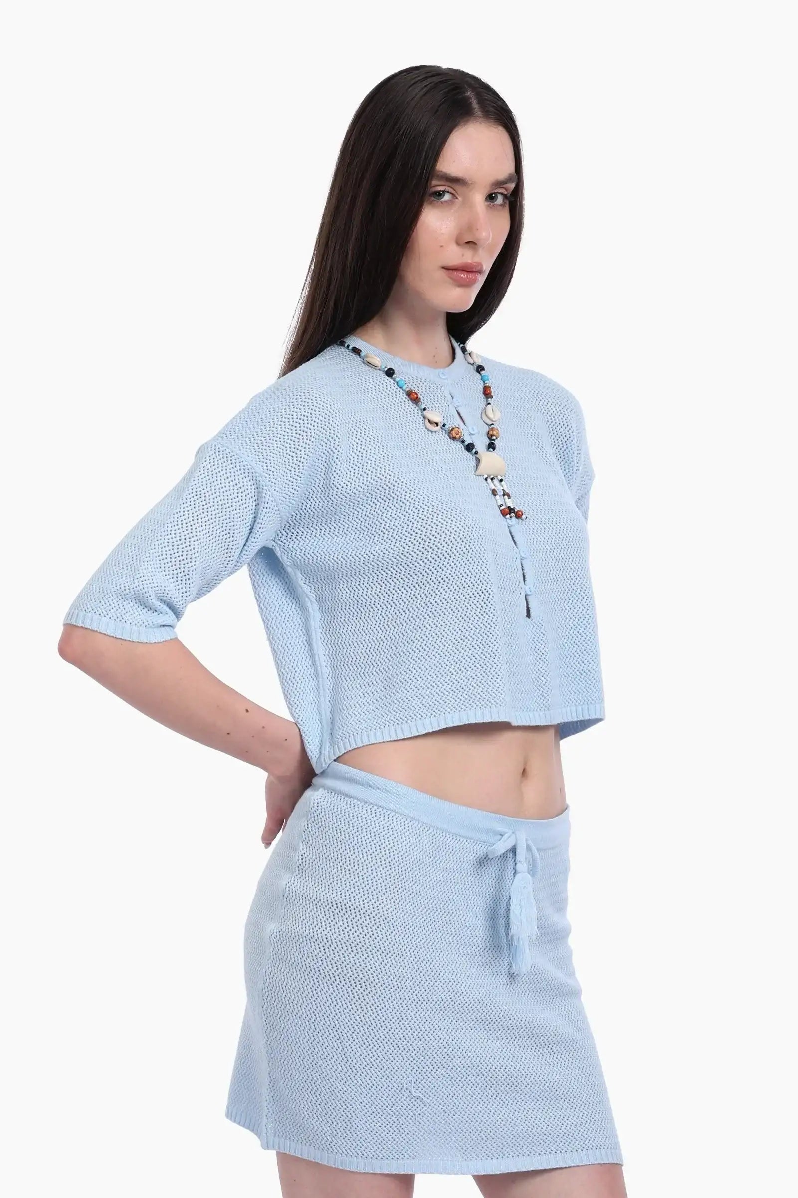 طقم تريكو من بلوزة قصيرة وجيب