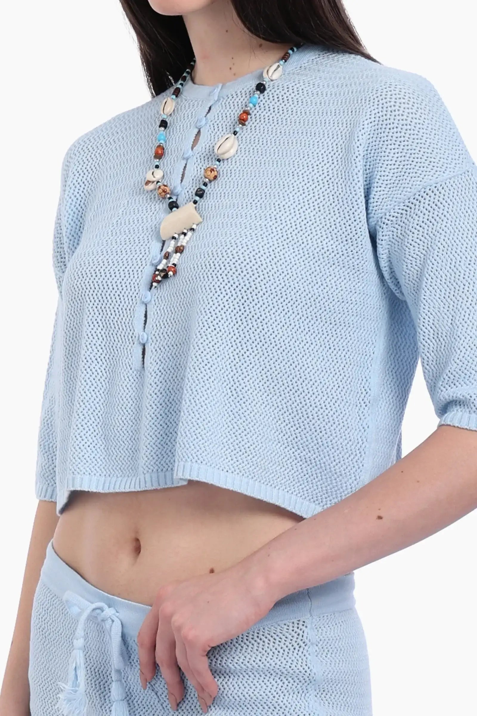 طقم تريكو من بلوزة قصيرة وجيب